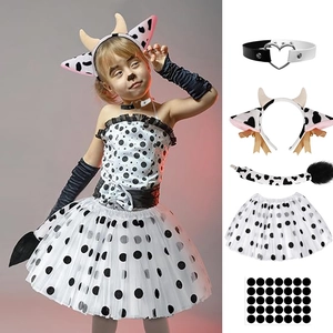 Detail view of cow cosplay set including polka dot dress, cow ear headband and plush tail