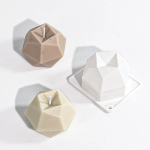 Detailed view of geometric diamond silicone mold and finished candle spheres