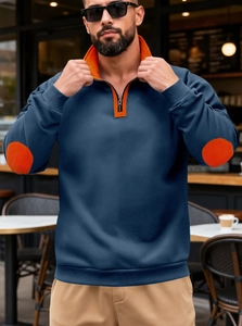 Détail du sweat-shirt pour hommes avec patchs orange aux coudes et col montant zippé