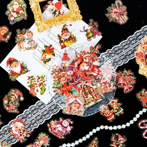Macro detail of vintage Christmas PET stickers with Santa and reindeer motifs for DIY
