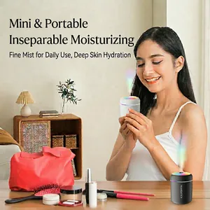 Mini portable humidifier with colorful LED light on bedroom desk for home hydration
