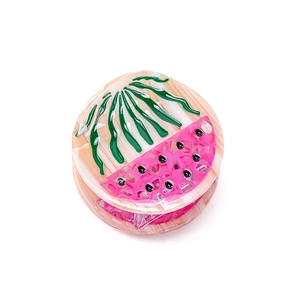 Watermelon pattern acetate hair claw clip with pink and beige resin finish in round shape