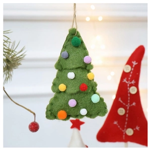 Close-up of a handmade green wool felt Christmas tree ornament with colorful plush pom-poms