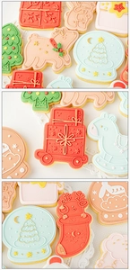 Detail of colorful Christmas fondant cookies featuring reindeer and snowflake icing designs
