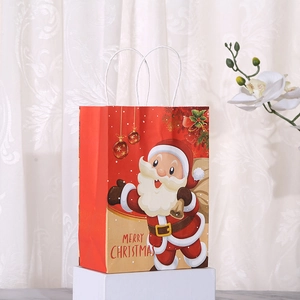 Red Christmas kraft paper gift bag with Santa Claus and Merry Christmas greeting