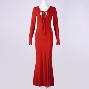 Close-up of a red slim fit knit dress with lace-up cutout neckline and side slit detail