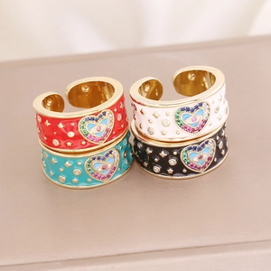 Colorful enamel evil eye rings in red, white, blue and black with gold finish