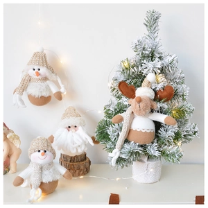 Detailed close-up of plush Christmas ornaments with Santa, Snowman and Reindeer characters
