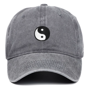 Dark grey washed denim baseball cap with Tai Chi Yin Yang embroidery on a white background