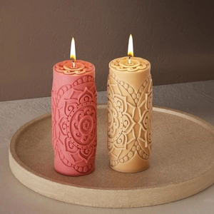 Mandala embossed cylindrical candle silicone mold with intricate sun and moon patterns
