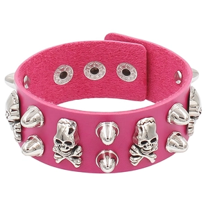 Detail of pink PU leather punk bracelet with silver skull charms and metal spike studs