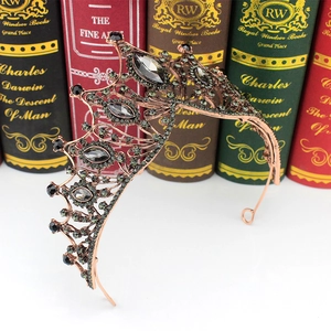 Detail of vintage Baroque bridal crown with black crystals on rose gold metal base