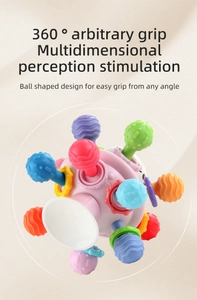 Close-up of baby sensory ball with colorful textured tubes and suction cup base