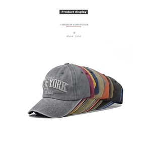 Detailed view of multiple vintage washed cotton baseball caps with New York embroidery