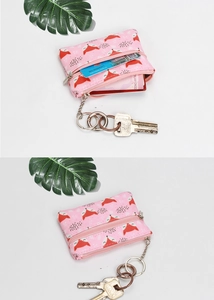 Pink canvas mini wallet with fox print showing card slots and metal keychain detail