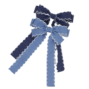 Denim bow hair clip set in light and dark blue with white lace trim and long tassels