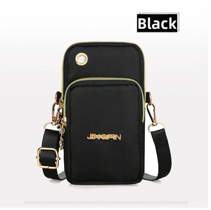 Detail of black nylon phone bag with gold metal logo and convenient earphone hole design