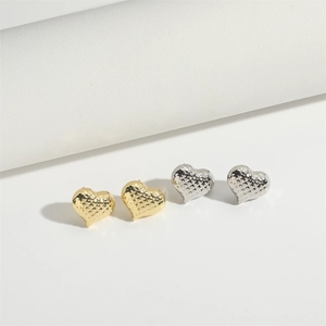 Minimalist heart-shaped stud earrings with quilted texture in gold and silver finishes