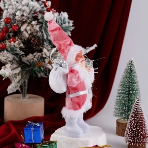 Detail of pink velvet standing Santa Claus figurine with white gift bag and snowy boots
