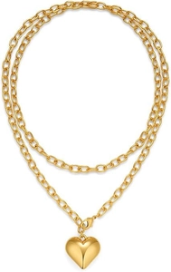 Detail of double-layer gold heart pendant necklace with high-polish finish and lobster clasp