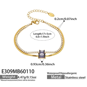 Macro detail of gold-plated layered chain with cubic zirconia and purple square stone