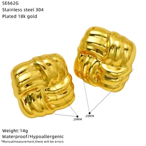 Detail view of 29mm square woven knot earrings in 18k gold plated stainless steel