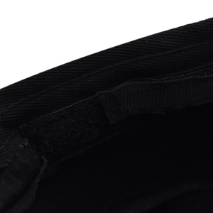 Detail of adjustable velcro strap and reinforced stitching inside black wool beret