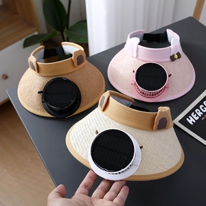 Detail of pink, yellow and beige sun hats with built-in solar fans and cute cat ears