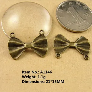 Detail of vintage bronze bow charms, size 21x15mm, zinc alloy pendants for DIY jewelry