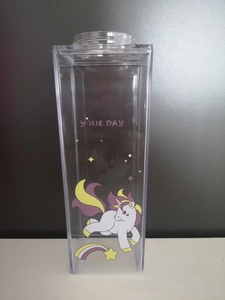 Detail of square plastic milk carton water bottle with pink unicorn and enjoy your day text