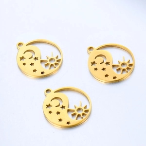 Three gold stainless steel charms with sun moon and star cutouts in yin yang design