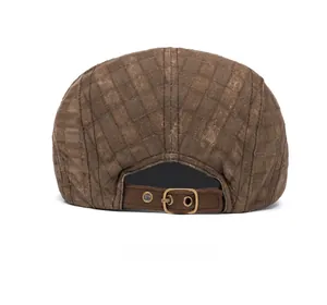 Rear view of brown plaid newsboy cap featuring adjustable metal buckle and retro texture