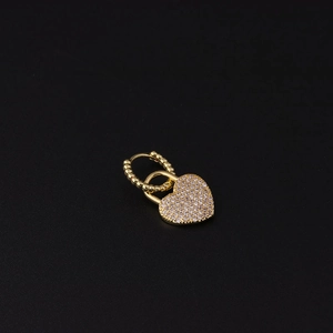 Detail of gold-plated heart lock earrings with micro-paved white cubic zirconia stones