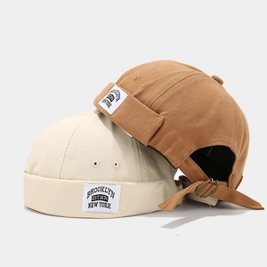 Retro canvas docker hats in beige and brown with Brooklyn New York patch detail