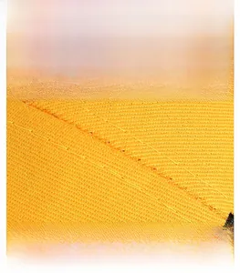 Detail of yellow twill fabric baseball cap featuring reinforced stitching and premium weave