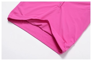 Detail of rose red yoga t-shirt showing double-stitched hem and metal button texture