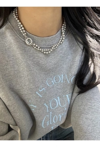 Detail of double-layer grey glass pearl necklace with square zircon pendant on model