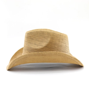 Close-up of the breathable woven texture and curved brim of this vintage cowboy straw hat