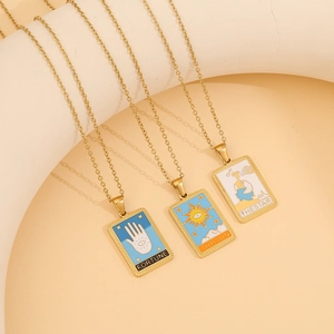 Three gold stainless steel tarot necklaces featuring Fortune, Sun, and Star enamel pendants