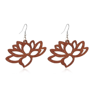 Detailed view of hollowed-out lotus flower wooden earrings in a rich brown finish