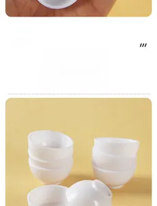 Detailed view of stacked miniature white ceramic tea cups for DIY dollhouse scenes