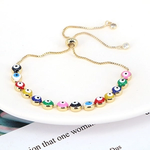 Detail view of colorful evil eye beads on gold chain with adjustable slide clasp