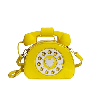 Borsa a tracolla creativa a forma di telefono retrò in pelle verniciata giallo lucido