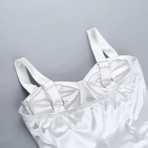 Close-up of white satin dress straps with silver metal adjusters and fine stitching