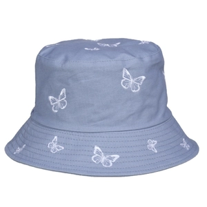 Blue cotton bucket hat with white butterfly embroidery on a clean white background