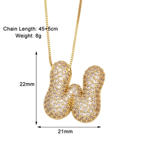 Detail view of 22mm gold letter W pendant with cubic zirconia and chain measurements