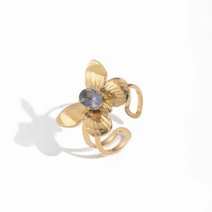 Detailed macro view of 18K gold butterfly ring featuring a lavender gemstone center