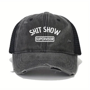 Detailed macro of the distressed visor and mesh back on this black SHIT SHOW baseball cap