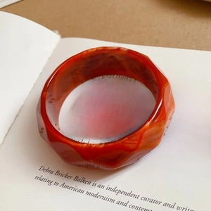 Minimalist faceted acrylic bangle with vintage amber marble texture in dark red and orange