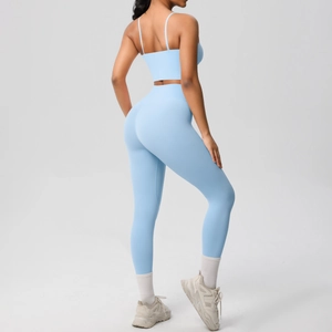 Detail of light blue yoga set with open back sports bra and high waisted leggings